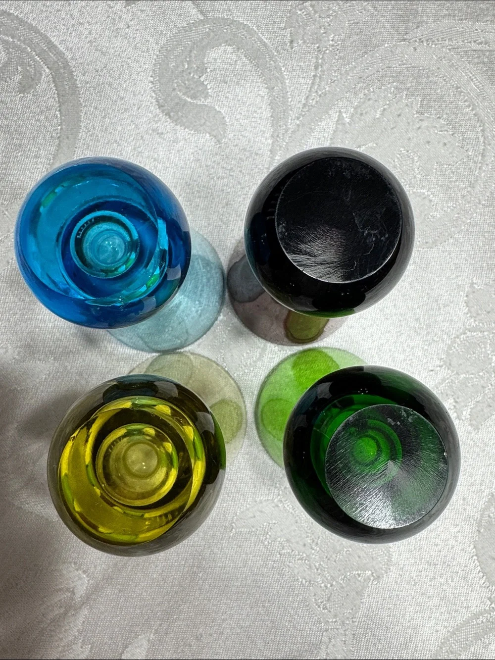 (4) MCM hand blown multi colored shot glasses.